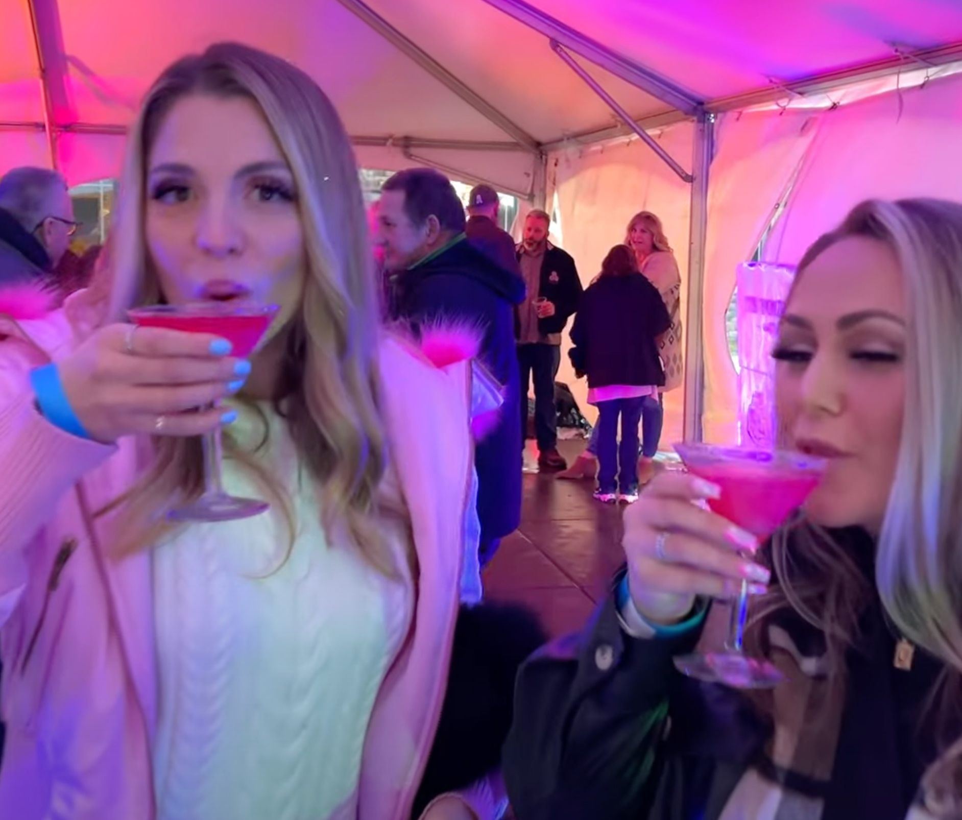 Two women drinking cocktails during the Fire and Ice celebration at the Watkins Glen Harbor Hotel